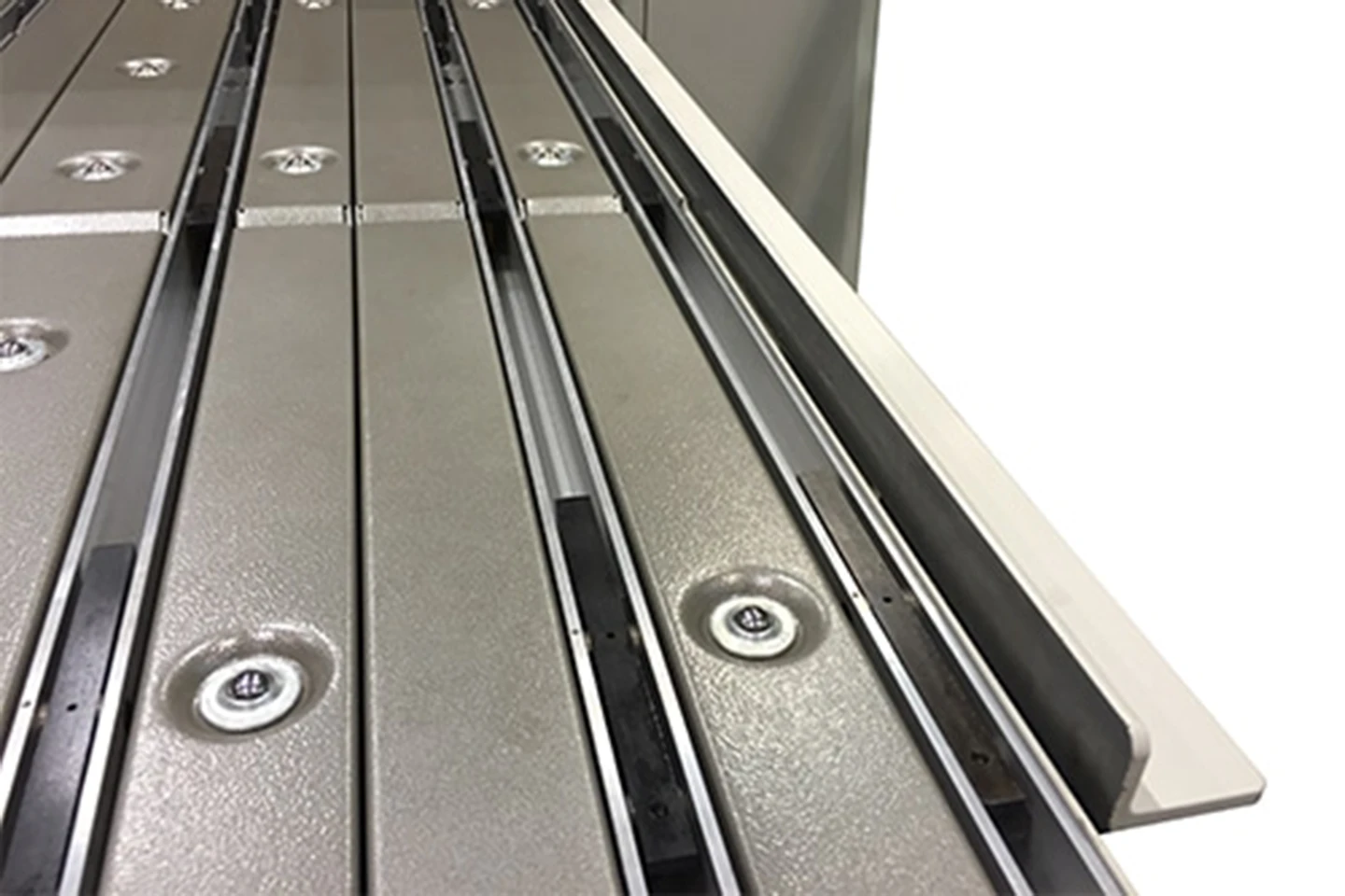 squaring arm on backgauge to a folding machine on white background