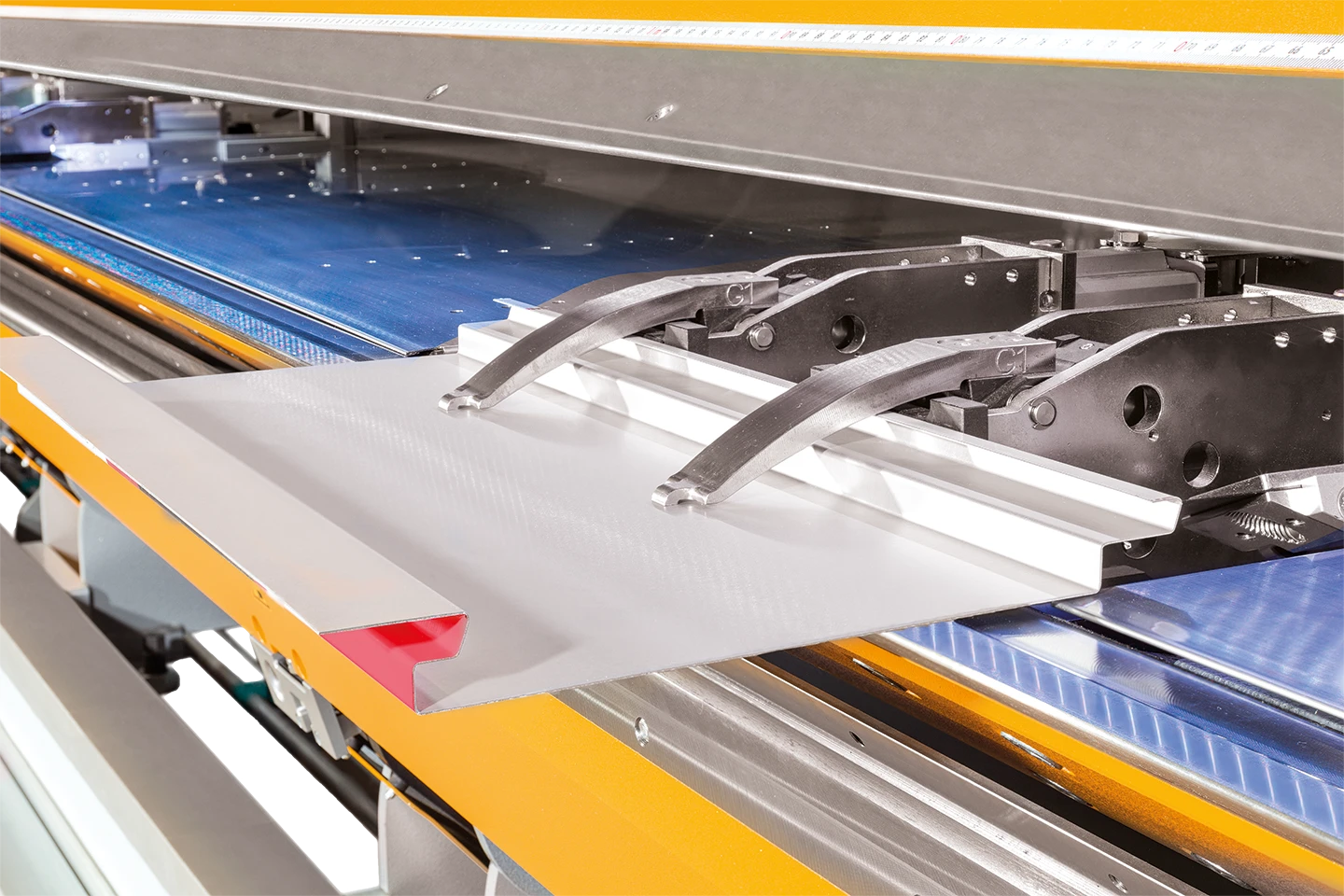 double gripper units holding a sheet in a thalmann machine on white background