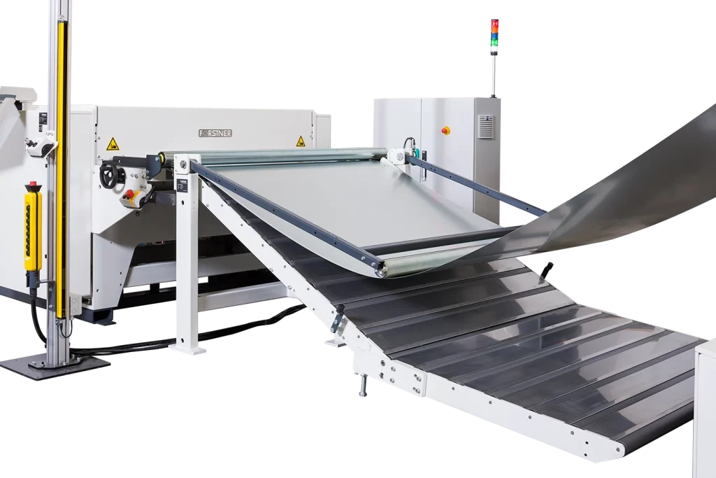 roller lift table for safe infeed of material to cut to length machine on white background