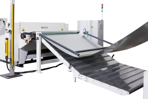 roller lift table for safe infeed of material to cut to length machine on white background