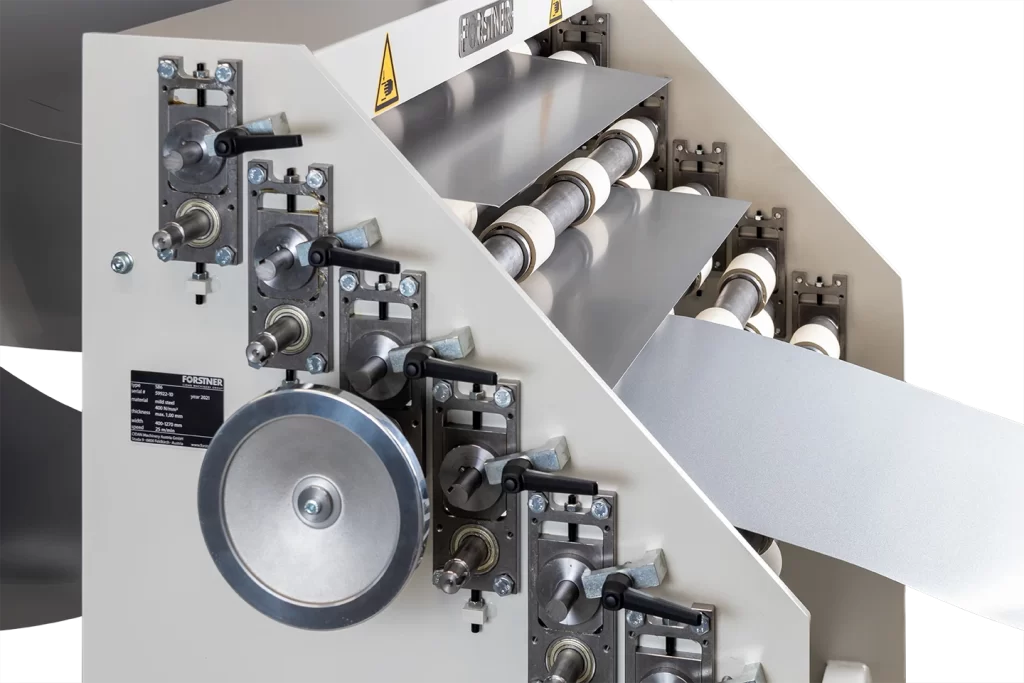 material hold in place in front of the cut to length machine with manual coil selector on white background