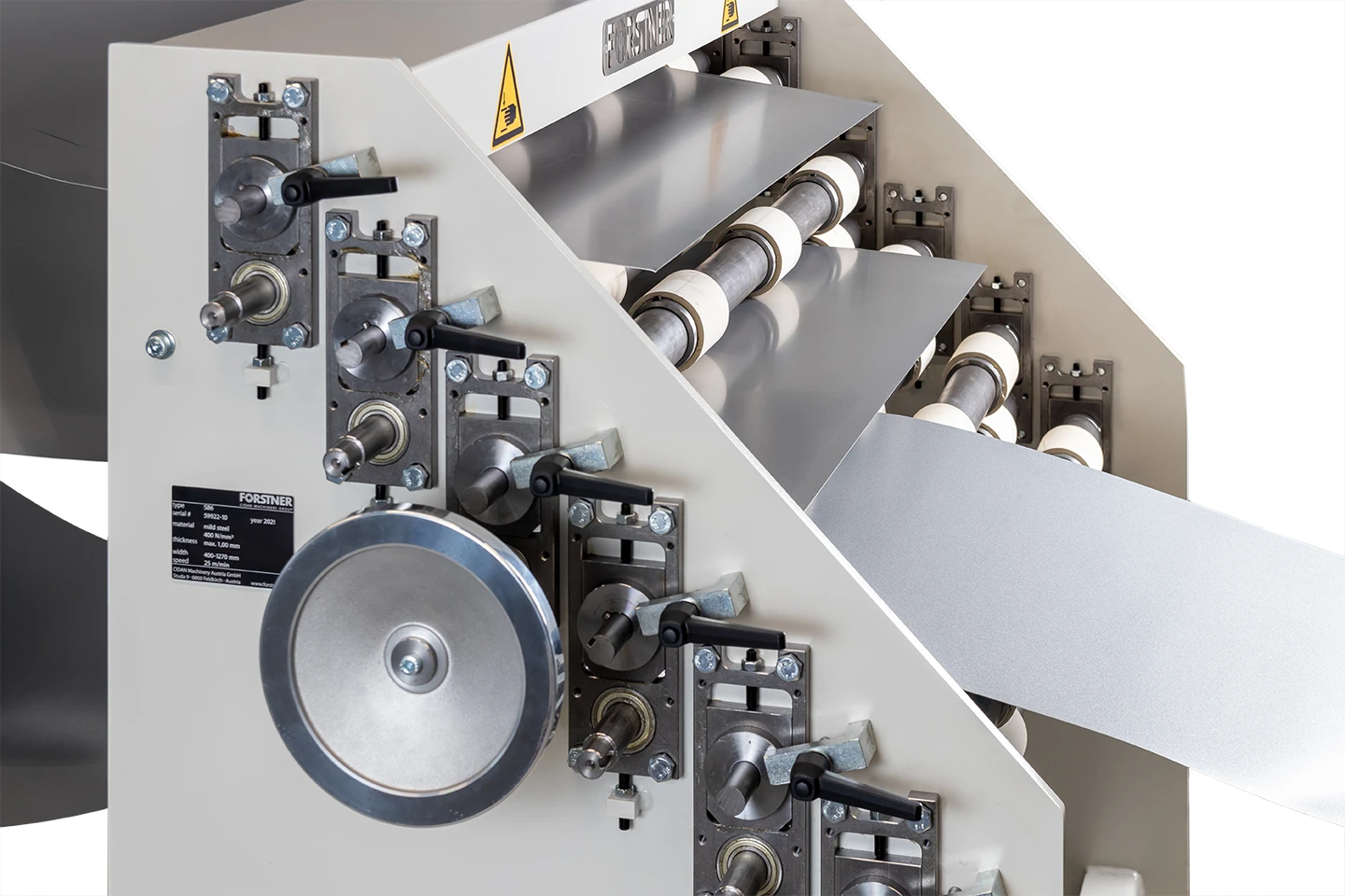 material hold in place in front of the cut to length machine with manual coil selector on white background