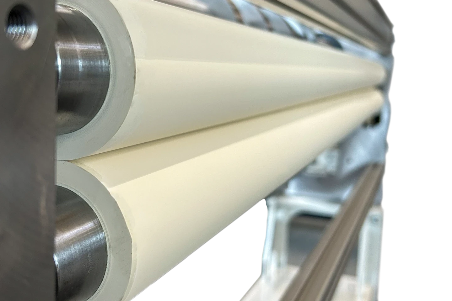rubberized infeed rollers for foil application in a cut to length machine on white background