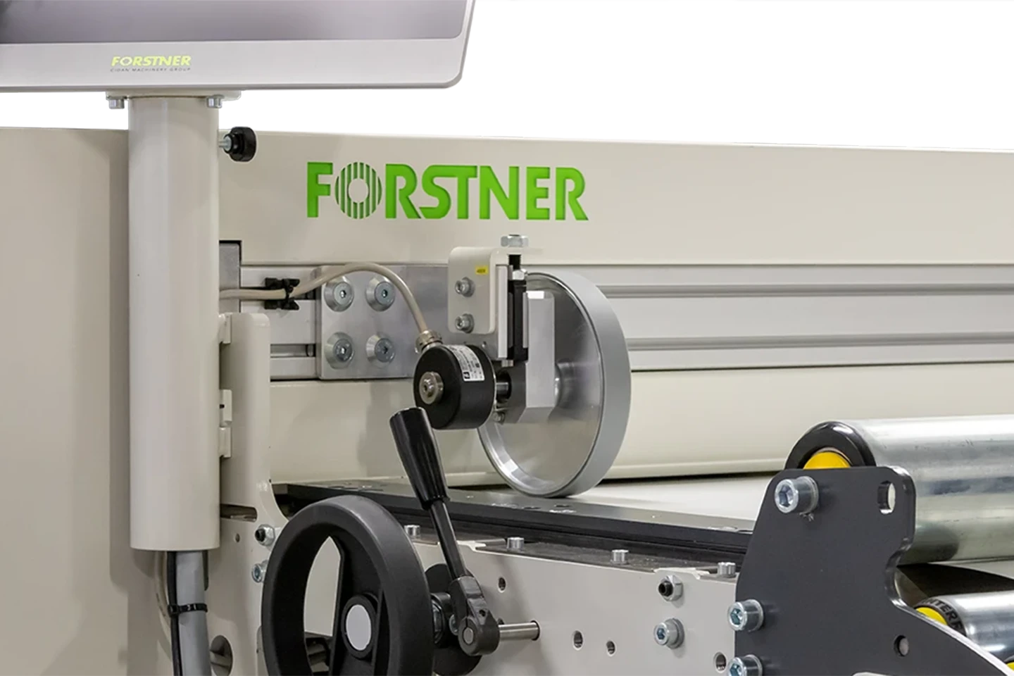 encoder measuring the infed length of the material to a cut to length machine on white background